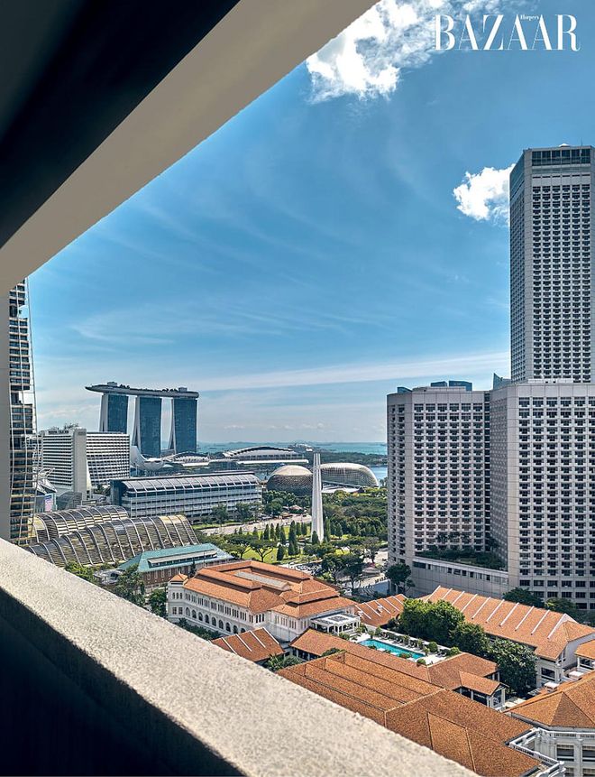 The stunning view from his high-floor apartment overlooking the Raffles Hotel and Marina Bay area