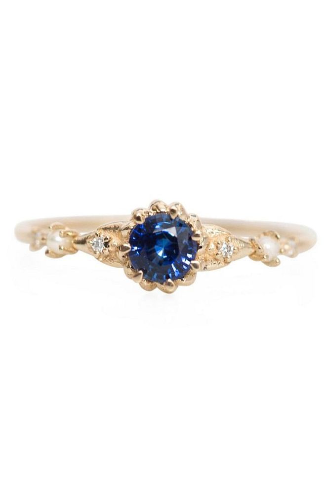All sapphire engagement rings don't have to be princess or emerald-cut. Cat Bird's Sapphire ring is beautifully unique, surrounded by dainty pearls and diamonds. Cat Bird Sapphire Ring, S$1,748