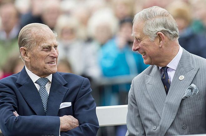 Prince Philip and his son Prince Charles attend the unveiling of a statue of Queen Elizabeth and her mother in Poundbury, Dorset.
