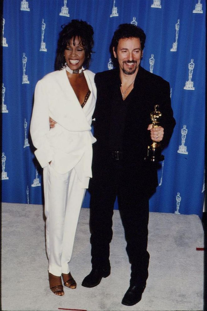 Whitney Houston attended the '94 Oscars as a presenter, standing out in a sea of beautiful gowns in louche white suiting.