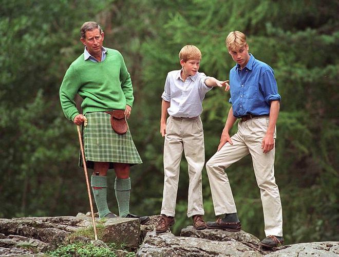 Prince Charles took Prince William and Prince Harry into the woods on the Balmoral Castle Estate, where Harry pointed something out to the group.
Photo: Getty 
