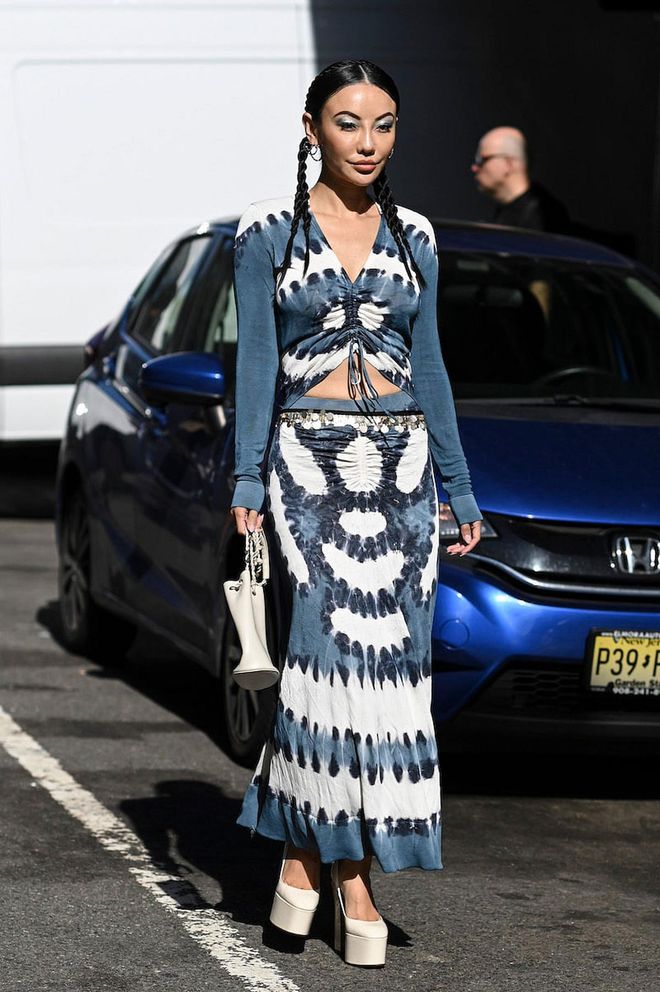 NEW YORK, NEW YORK - SEPTEMBER 10: Jessica Wang is seen wearing a white and blue tie dye dress outside the Altuzarra show during New York Fashion Week S/S 2023 on September 10, 2022 in New York City. (Photo by Daniel Zuchnik/Getty Images)
