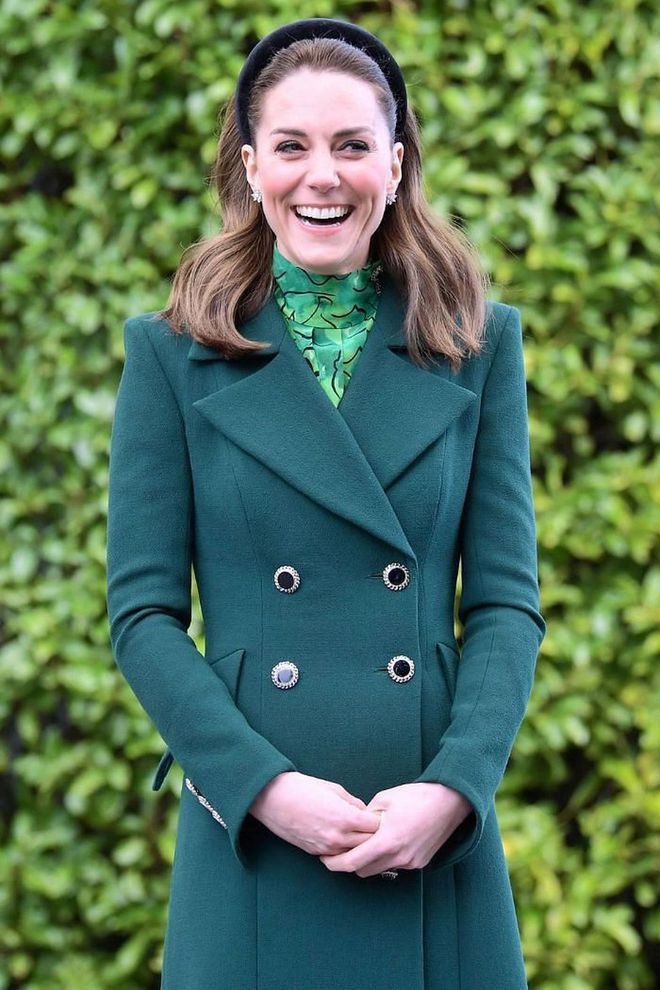 The duchess wore a spring-appropriate outfit during her first day in Ireland, donning a flowing Alessandra Rich midi dress, Catherine Walker overcoat, and matching suede shoes and clutch.

Photo: Getty
