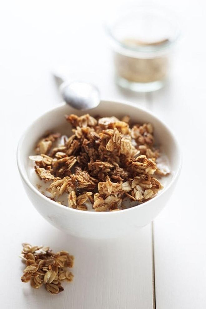 Granola might sound like a healthier choice than cereal, but in addition to being higher in calories, they can contain a lot of added sugar and little protein, causing your blood sugar to crash. Instead, top your yogurt with raw nuts.