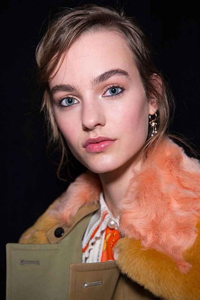 Kohl-lined eyes, flushed lips and cheeks and brushed up brows set the tone at Coach.