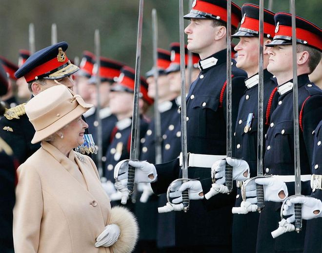 Her Majesty smiles proudly at Prince Harry during the Sovereign's Parade at Sandhurst Military Academy. Photo: Getty