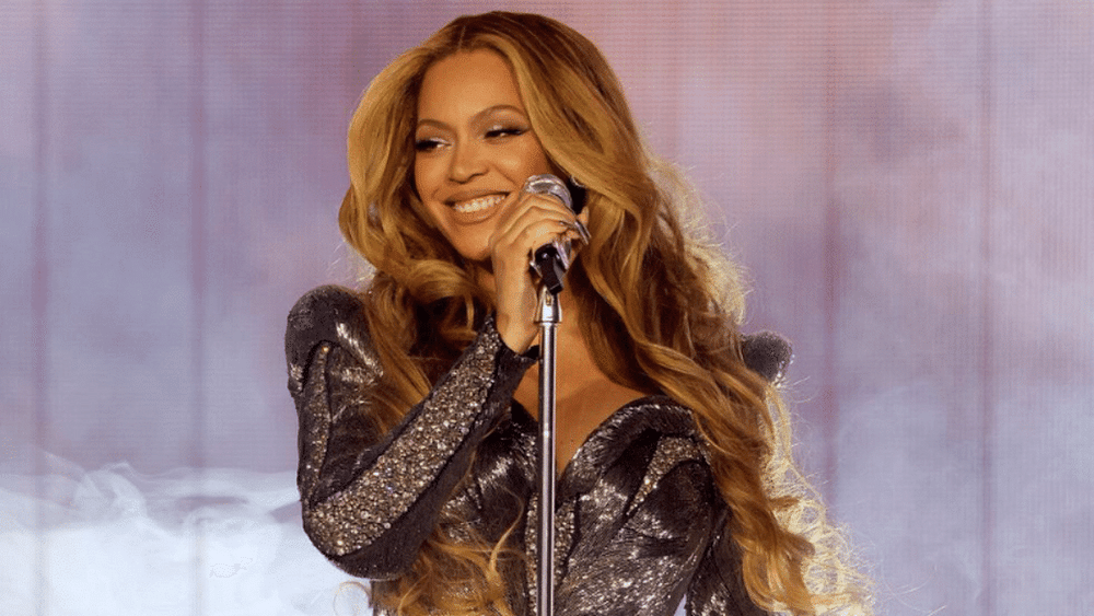 Beyoncé's Latest Tour Outfit Is A Plunging Red Cape Minidress