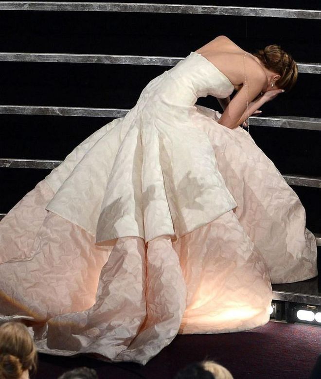 The world took a collective gasp when Jennifer Lawrence tripped and fell as she went up on stage to collect her Leading Actress Oscar in 2013 - but while she might wish the moment had never happened, it did allow us the perfect shot of her stunning Dior couture gown splayed out across the steps. The elegant gown, by then-creative director Raf Simons, featured a strapless neckline and textured double-layered skirt.

Photo: Getty