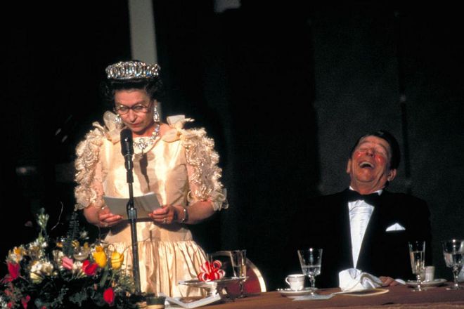 The Queen amuses Ronald Reagan during a state dinner, March 1983.

