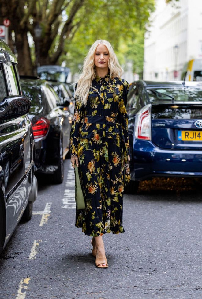 LONDON, ENGLAND - SEPTEMBER 18: Victoria Magrath wearing floral dress, green bag, heels outside Erdem during London Fashion Week September 2022 on September 18, 2022 in London, England. (Photo by Christian Vierig/Getty Images)