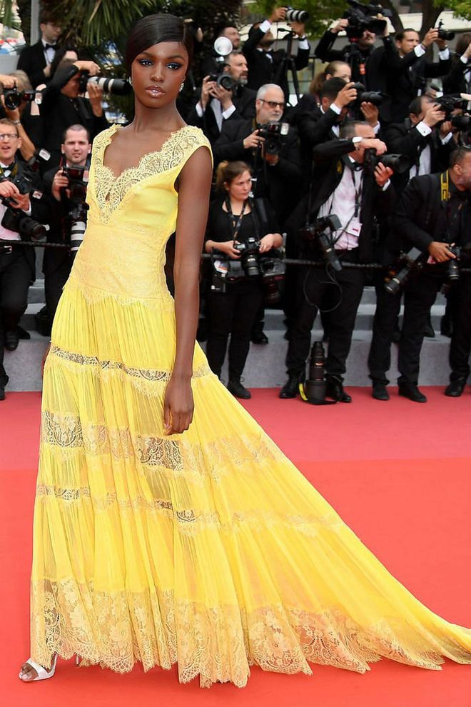 9 May: Leomie Anderson chose a lemon-yellow lace dress for the Yomeddine premiere. Photo: Getty