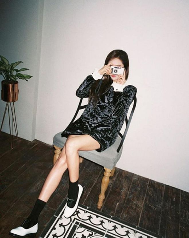 All dressed up in a Blanc and Eclare velvet babydoll dress, Jung adds her signature socks and oxfords to finish the look. 
Photo: Instagram
