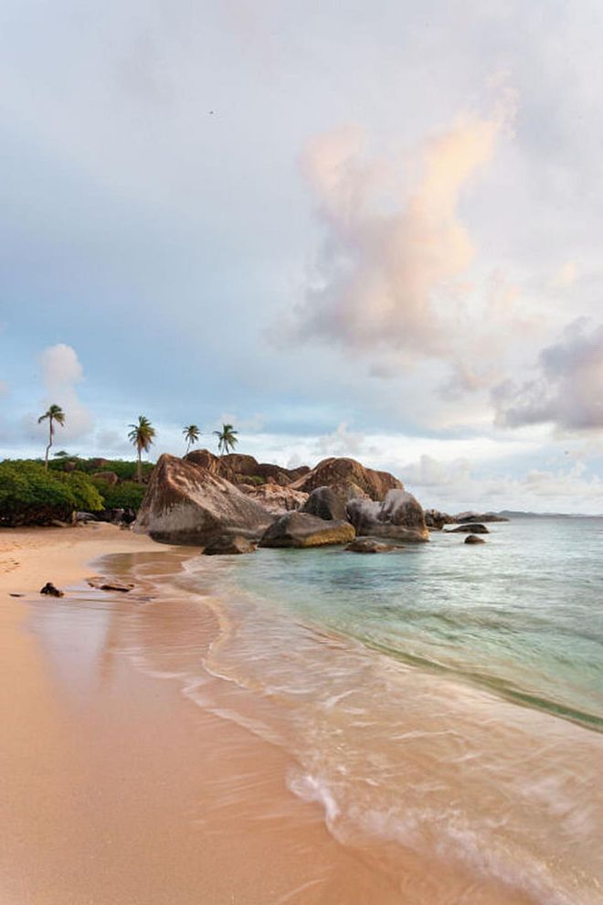 Large granite boulders line the coast at the southern tip of Virgin Gorda, forming shallow pools that make The Baths an ideal spot for swimming and snorkeling.