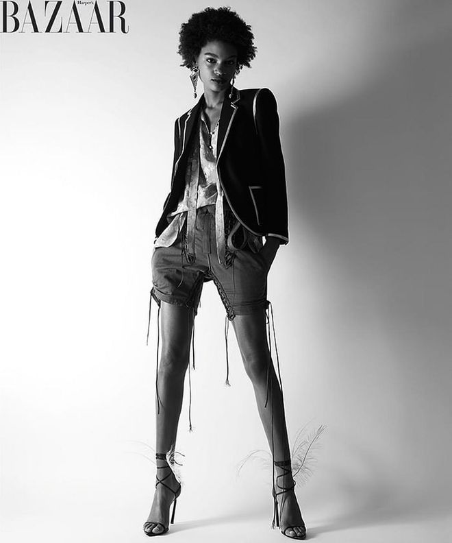 Saint Laurent by Anthony Vaccarello blazer, blouse, shorts, earrings, and sandals