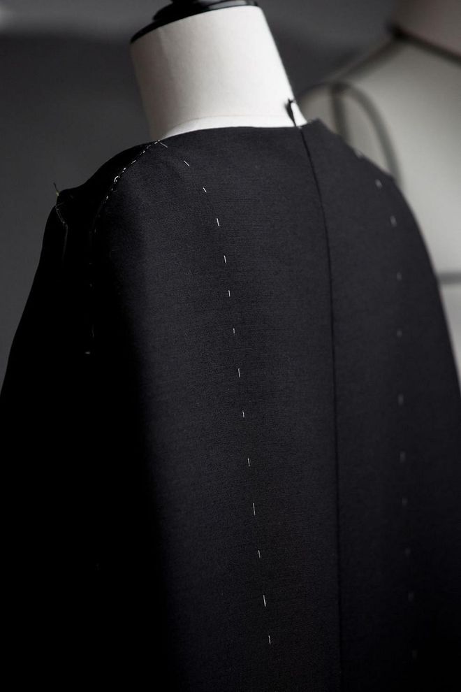 Portman's cape was made using wool and silk for the body of the look, while the lapels were created with satin cuir.
