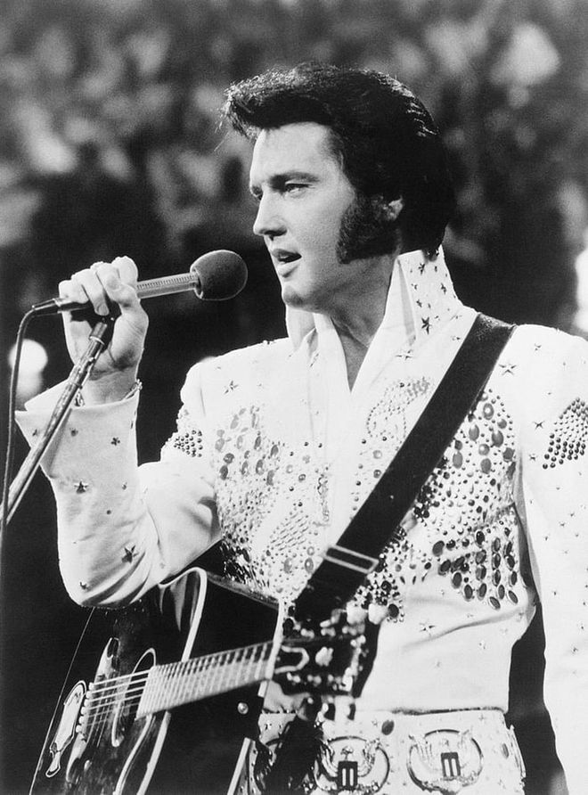 "The King" performing in one of his signature, bejeweled costumes. Photo: Getty 

