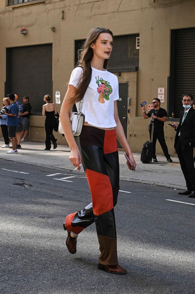 NEW YORK, NEW YORK - SEPTEMBER 10: Lulu Tenney is seen wearing a white shirt and black and orange pants outside the Altuzarra show during New York Fashion Week S/S 2023 on September 10, 2022 in New York City. (Photo by Daniel Zuchnik/Getty Images)