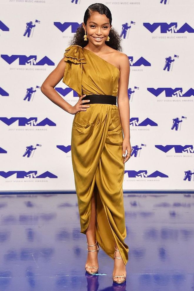 The Black-ish star glowed in a belted gold Zimmermann dress.