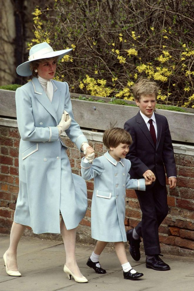 Paving the way for chic mommy-and-me dressing, Princess Diana wore matching pale blue coats with Prince William while out for a royal appearance in the early '80s. The two wore the same double-breasted jacket, but Diana accessorized hers with a floppy hat, while William wore socks and Mary Jane shoes. Photo: Getty