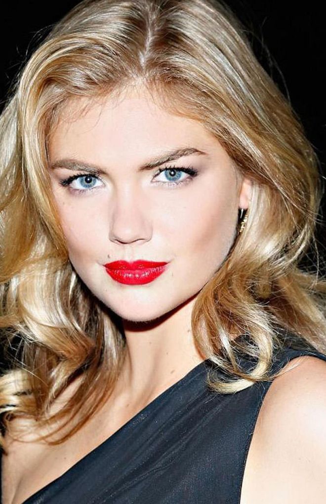 Kate Upton regularly teams her brows with a striking red lip and luminous skin.