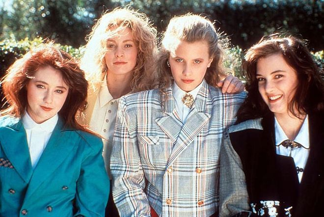 The 1980s clique mashed all the power trends of the decade into one look—shoulder pads, oversized blazers, and big jewelry—to rule the school.

Photo: Getty