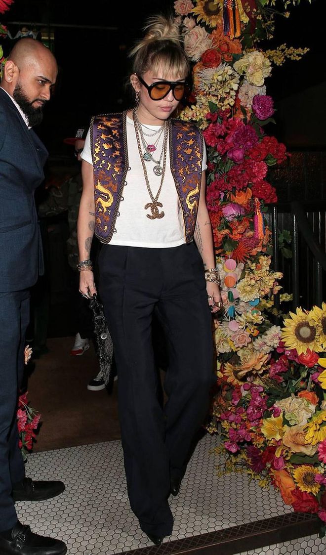 The star wore tailored trousers, an ornate embroidered waistcoat, with an assemblage of Chanel jewels for a dinner date in London.

Photo: Getty