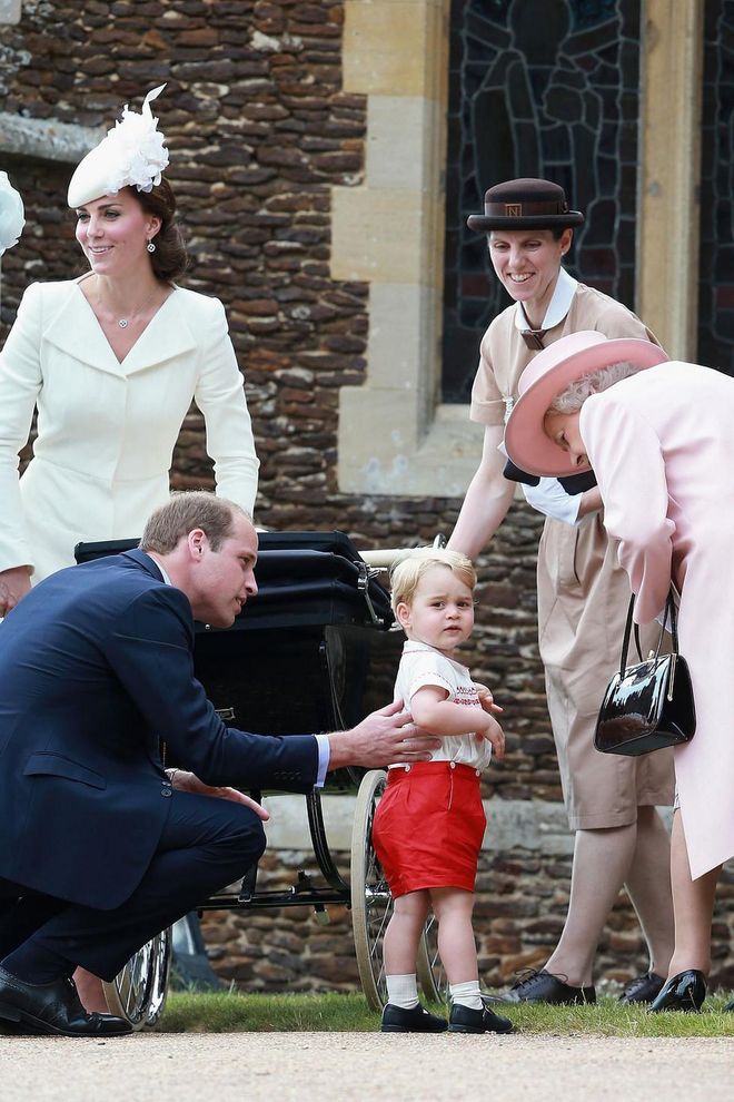 Prince William instructs Prince George to say hello to his grandmother, Queen Elizabeth II, while leaving the Church of St Mary Magdalene after the Christening of Princess Charlotte on July 5, 2015.

Photo: Getty