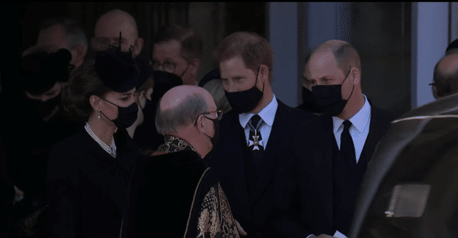 Prince Harry chatting with Prince William and Kate Middleton following today’s funeral service. (Photo: BBC YouTube)