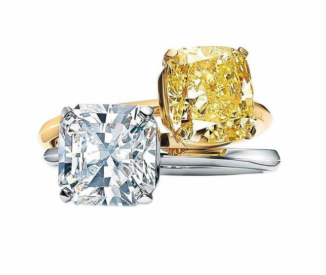 Tiffany True engagement rings in gold with a fancy yellow diamond; platinum with a white diamond. (Photo: Tiffany & Co.)