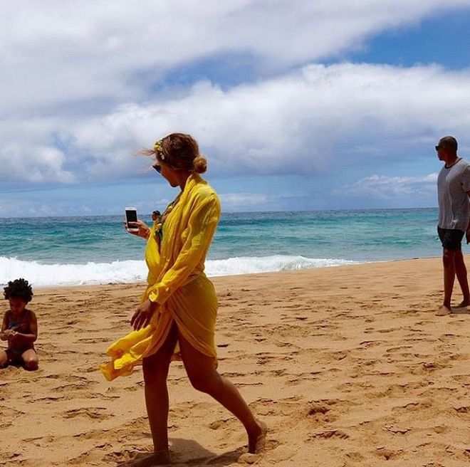 In which Beyoncé makes us all lust over a marigold beach wrap and a Coachella-worthy flower crown. <b>Bright Yellow Pashmina Scarf, S$18</b>
