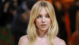 Sydney Sweeney Just Stepped Out In A Plunging Yellow Dress With A Thigh-High Slit