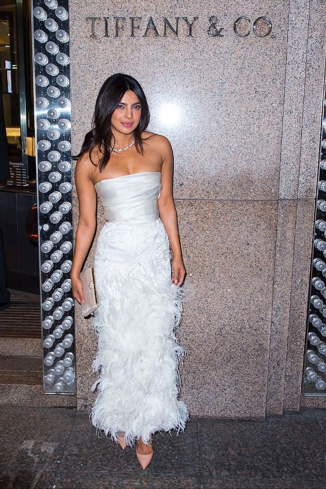 For her bridal party at Tiffany &amp; Co., Priyanka looked angelic in a white strapless feathered gown by Marchesa.

Photo: Getty