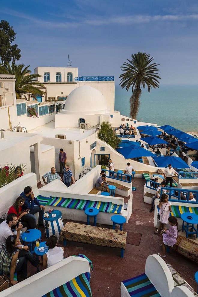 Even though the buildings in the second largest city in Tunisia are mostly white, when paired with blue umbrellas and the blue ocean, it becomes a colorful oasis. It doesn't hurt that purple Bougainvillea flowers are common here, too.
