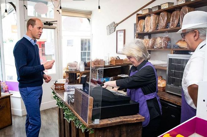 The prince was photographed using his contactless card to purchase goods in the bakery.
