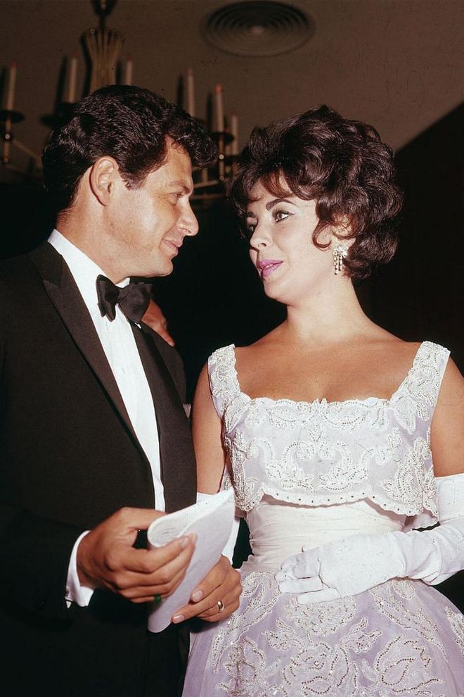 While Elizabeth Taylor did coin the phrase, "diamonds are a girl's best friend," she kept her accessories to the minimal and really let her white lace dress do all the talking.