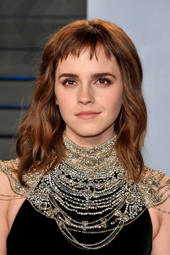 Less fussy and much more interesting than your standard fringe, choppy, ultra-short bangs like these on Emma Watson upgrade any cut's cool factor.
Photo: Getty