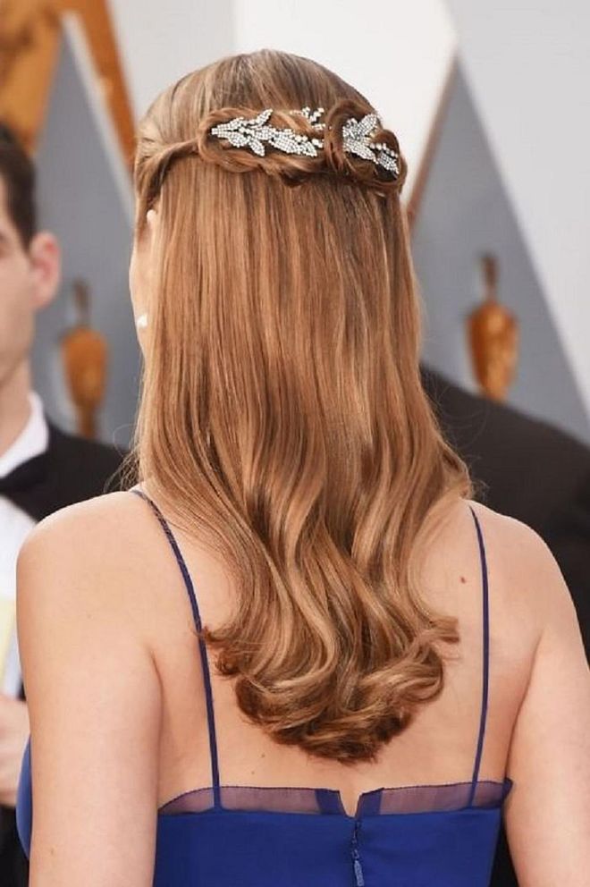 "Half-up can be very regal and elegant, " says Alcala. "It feels polished but still sexy. I generally like to only pull 1/3 of the hair up and leave the other 2/3 down so that the hair that is left down doesn't look too thin." Photo: Getty 