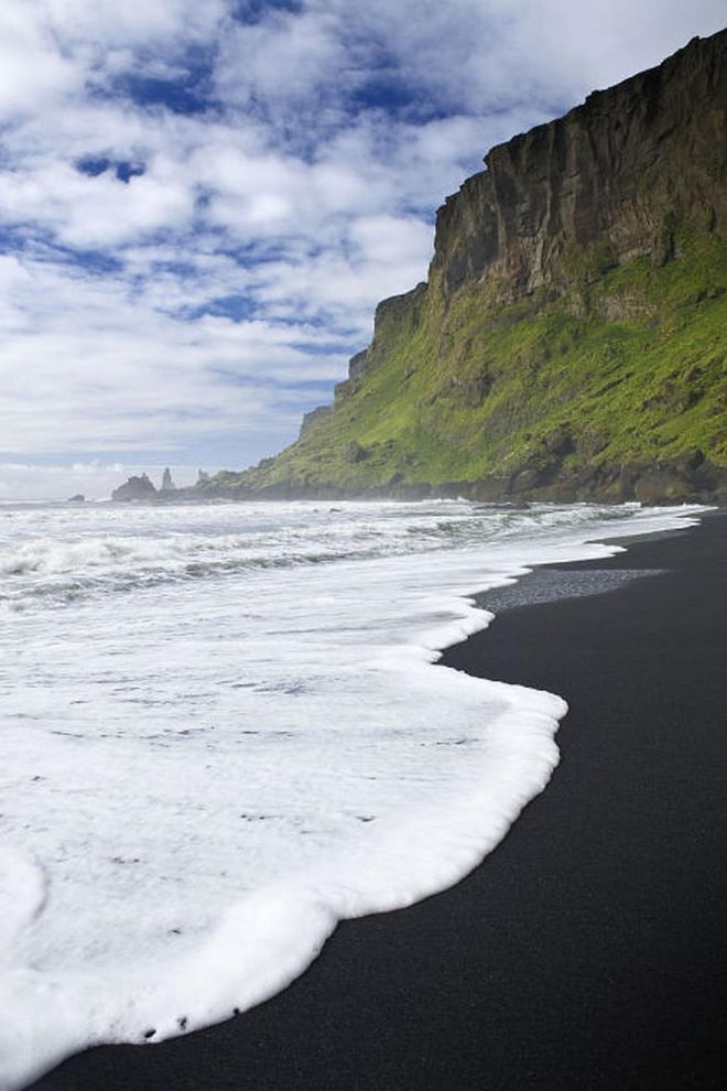 Iceland might not conjure up images of a beach vacation, but the black sand beaches of its southernmost town, Vik, are worth exploring.