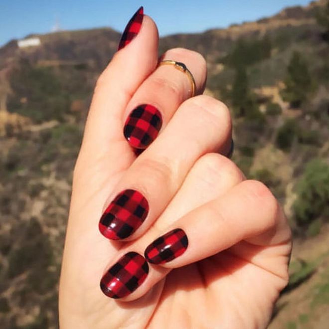 Post New Year's Eve-glitz, dress it down with a casual red and black gingham print.
@stephstonenails