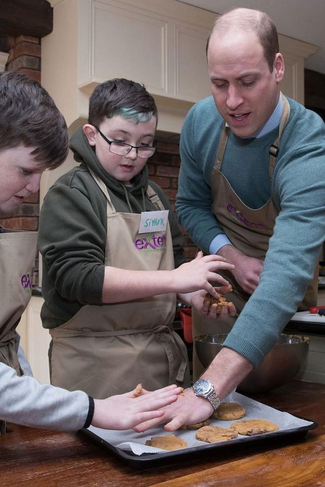 The Duke of Cambridge helps shape cookie dough during his visit to Savannah House.

Photo: Getty