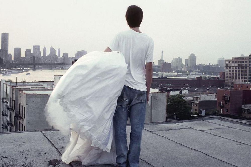A Zero + Maria Cornejo wedding dress with the World Trade Center in the distance, 1999. (Photo: Mark Borthwick)
