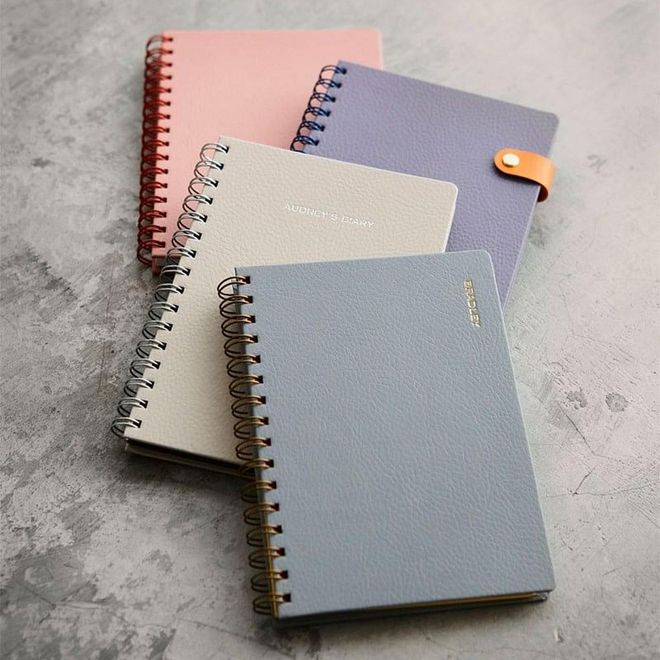 For a desk notebook just the way you want, you can customize your own notebook and get it bound by a trained artisan at homegrown paper goods store Bynd Artisan. Pick from everything from the cover, paper, to twin wires for your very own customized notebook. 