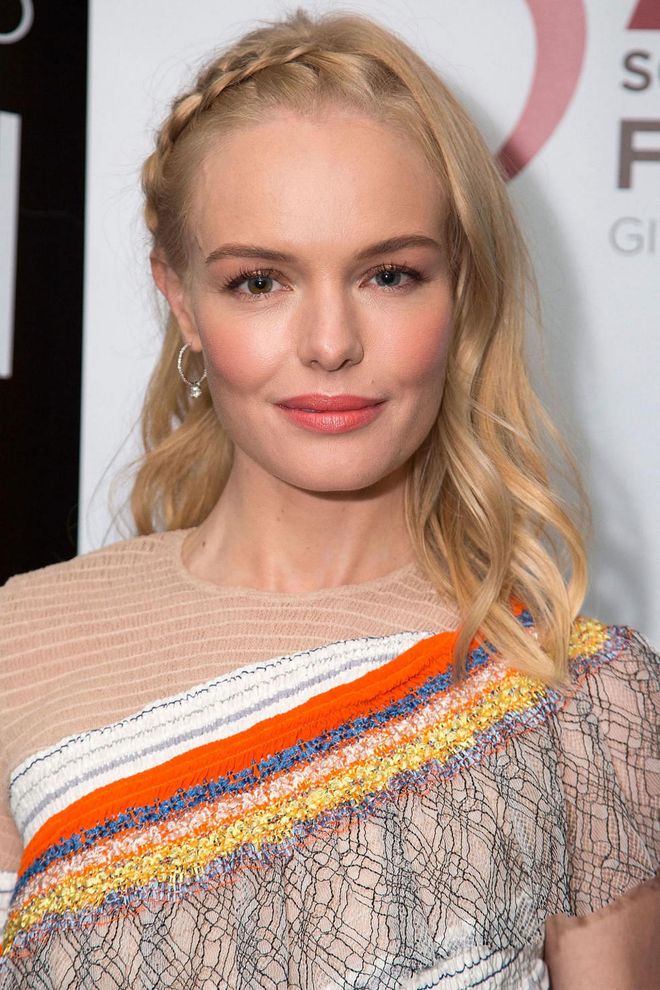 Dutch braid down from a side part for an edgier version of the milkmaid. Photo: Getty