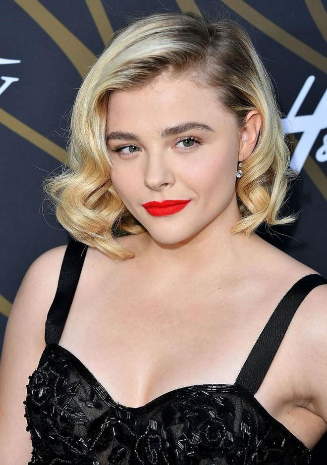 Think you need Rapunzel lengths to pull off bombshell waves? Take a note from Chloe Grace Moretz who pairs classic loose curls and bold red lipstick with a modern ombre dye job.

Photo: Getty