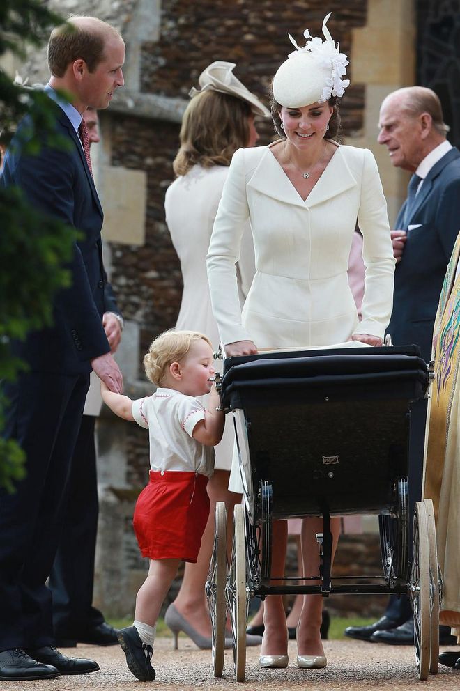 Little Prince George checks on his baby sister, Princess Charlotte, at her christening in July 2015. Prince William and Catherine, Duchess of Cambridge welcomed George in July 2013, and Charlotte was born in May 2015.
Photo: Getty 