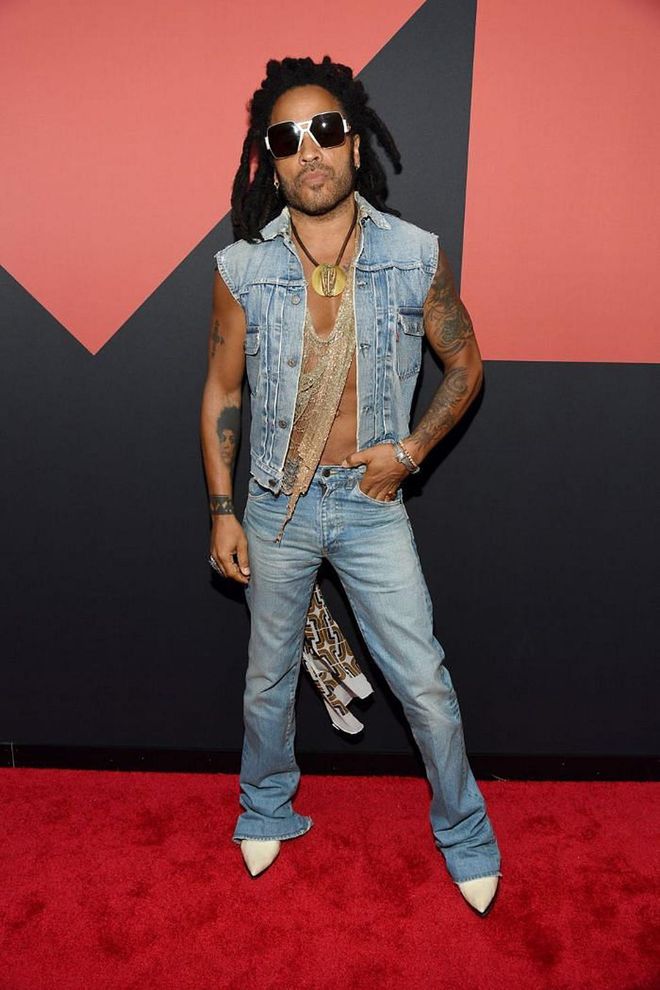 In a denim vest and jeans.

Photo: Getty