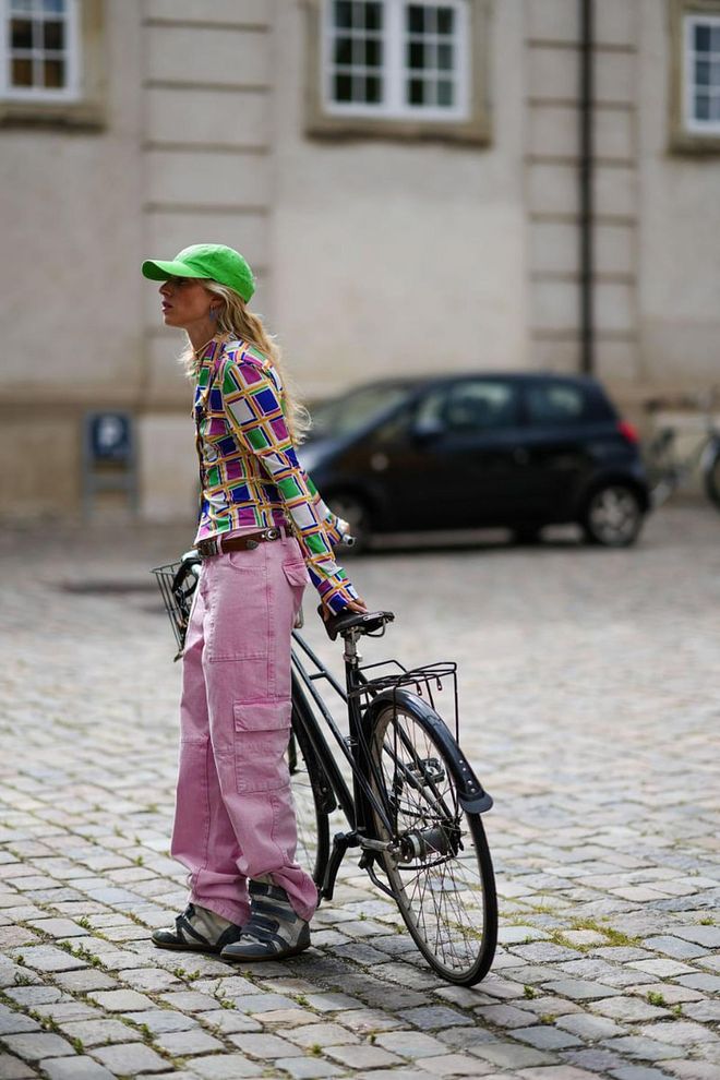 A guest at Copenhagen Fashion Week last August wearing a pair of sneaker wedges outside of a show