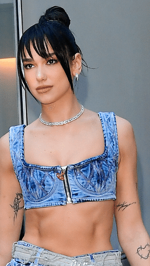 Dua Lipa Delivers A Lesson In Denim-on-Denim Styling Via A Bustier And Micro Miniskirt