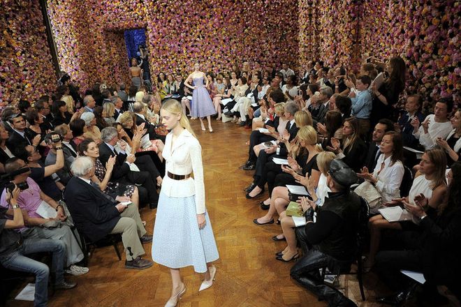 Hundreds of years of fashion have taught us plenty of things, including this doctrine: Florals never go out of style. Particularly, flowers that cover every wall at a Paris Fashion Week show. Here, Dior Haute designs echo the energetic femininity of the set's orange, pink and white flora. Not up for hot-gluing blooms to all your walls? Wallpapering a bath in a bold floral makes for a fun, intimate space.