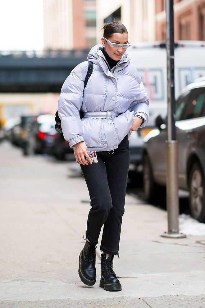 In a lilac puffer jacket and white skinny sunglasses. Photo: Getty 